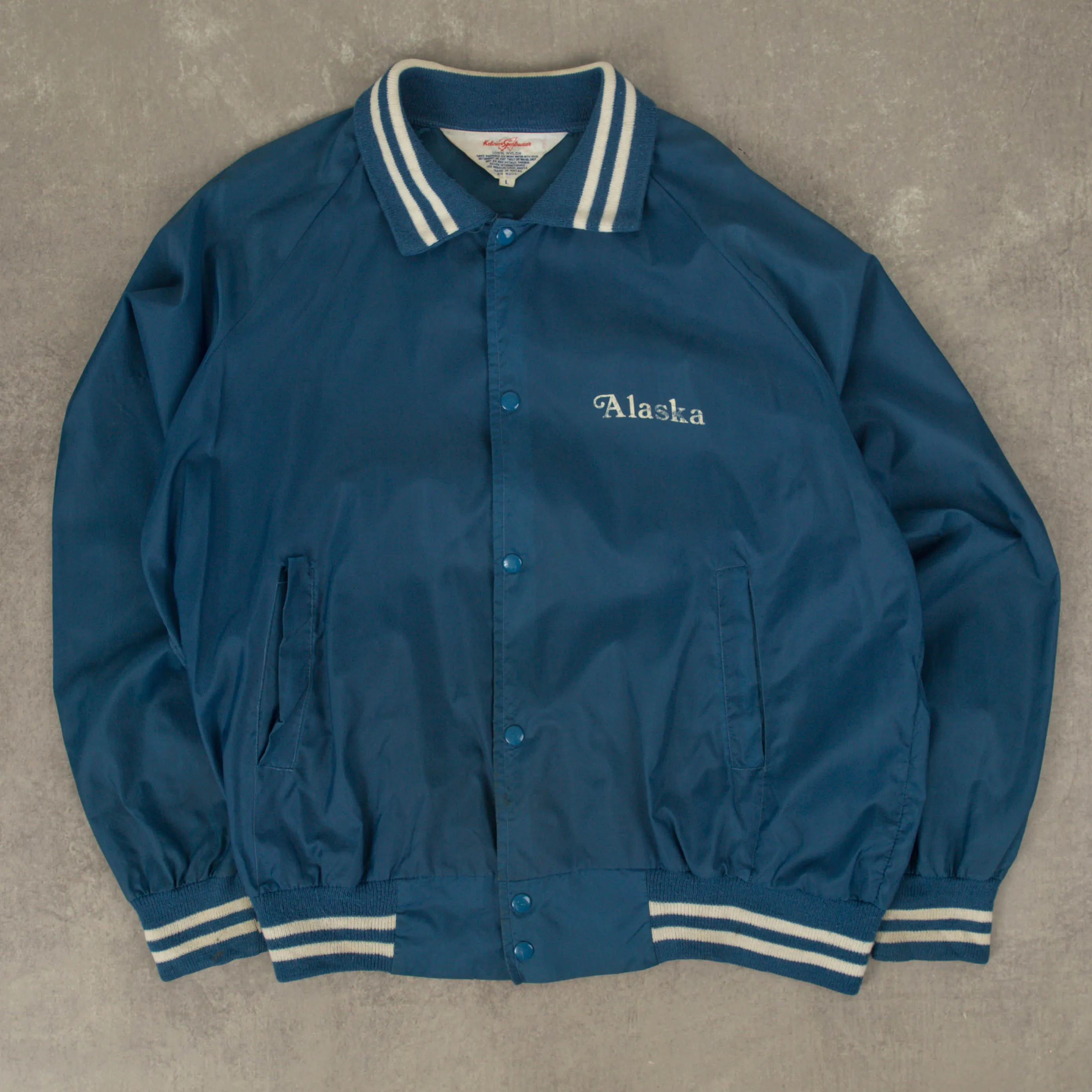 MEN'S VINTAGE 1990S ALASKA NYLON VARSITY BOMBER JACKET - LARGE